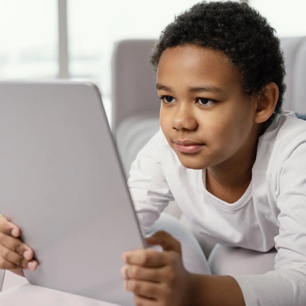 A young Builder exploring technology on a tablet